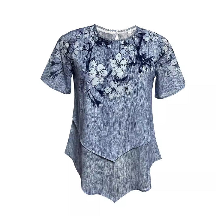 Women's two-layer blouse dress with asymmetrical tiered hem, floral print yoke, and wing sleeves StylebySassy