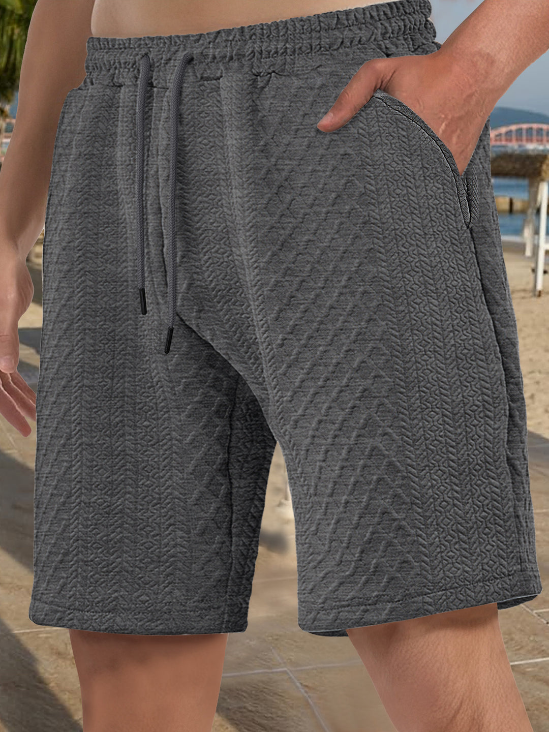 Men's textured beach bermuda shorts made of waffle jersey with elastic drawstring waistband and slanted pockets StylebySassy