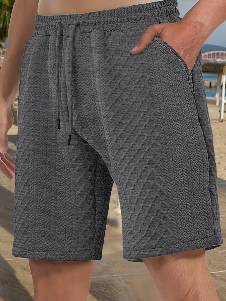 Men's textured beach bermuda shorts made of waffle jersey with elastic drawstring waistband and slanted pockets StylebySassy