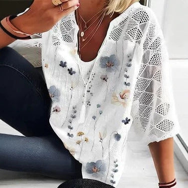 Women's V-neck tunic with lace-knit sleeves and subtle watercolor floral print StylebySassy