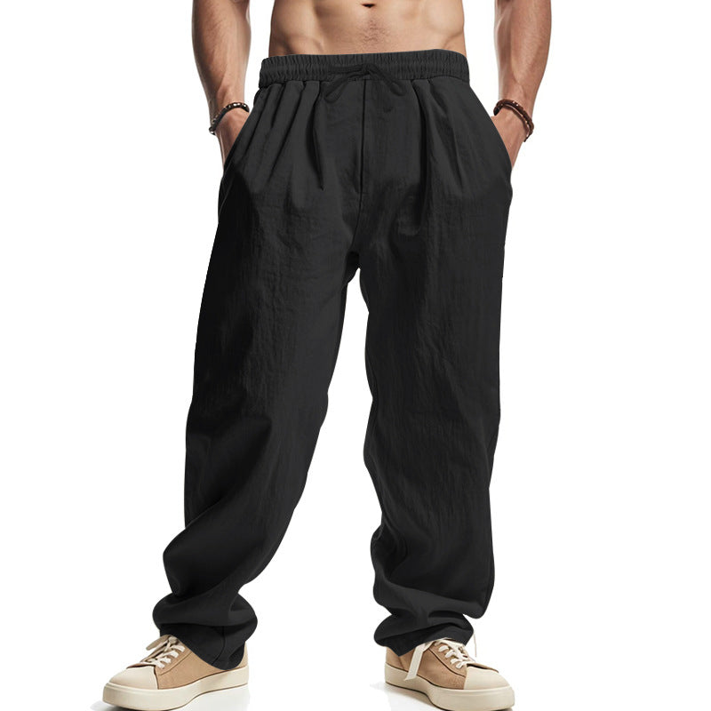 Men's loose leisure pants with elastic waistband, drawstring, and deep side pockets StylebySassy