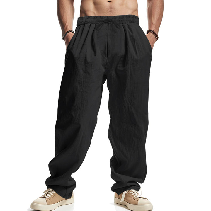 Men's loose leisure pants with elastic waistband, drawstring, and deep side pockets StylebySassy