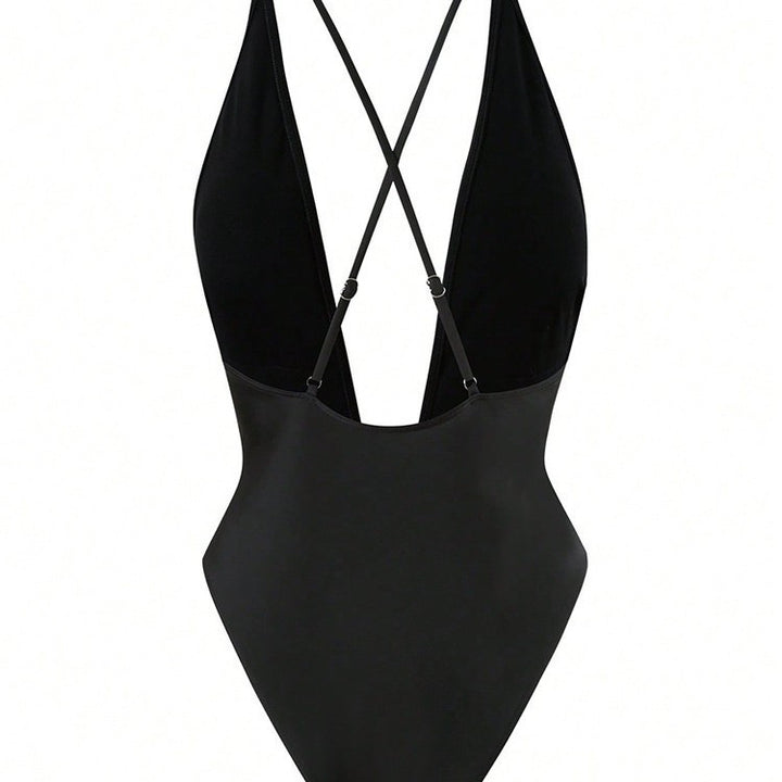 Women's one-piece swimsuit with deep V-neckline and elegant decorative element StylebySassy