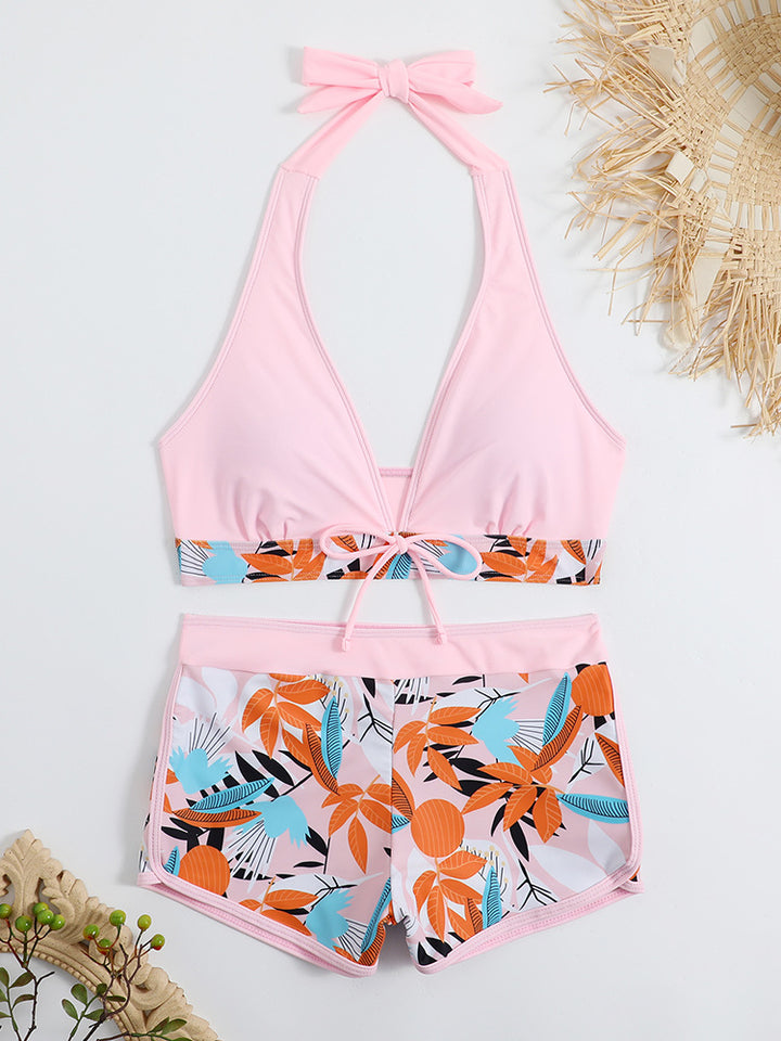 Women's sporty bikini set with adjustable halter top and shorts StylebySassy