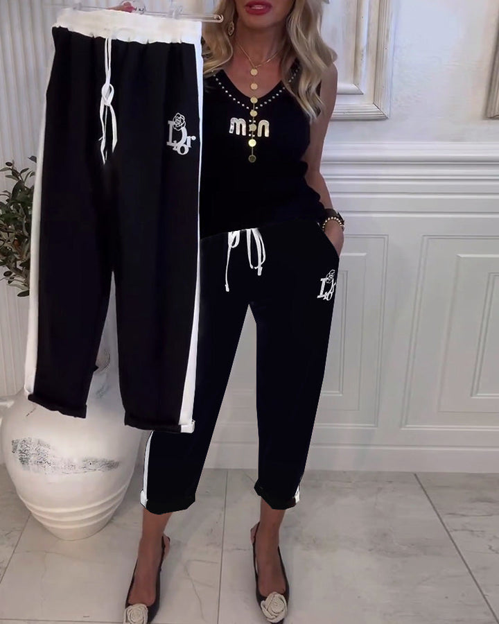 Women's cropped comfort joggers with side contrast stripes, elastic drawstring waist, and logo embroidery StylebySassy