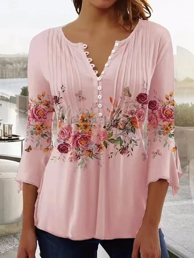 Ladies airy tunic blouse with watercolor floral border, knife pleats, and three-quarter sleeves StylebySassy