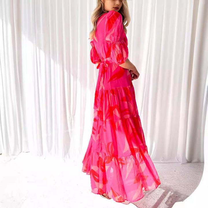 Ladies' flared maxi dress with V-neck, elastic underbust seam, and tiered skirt StylebySassy