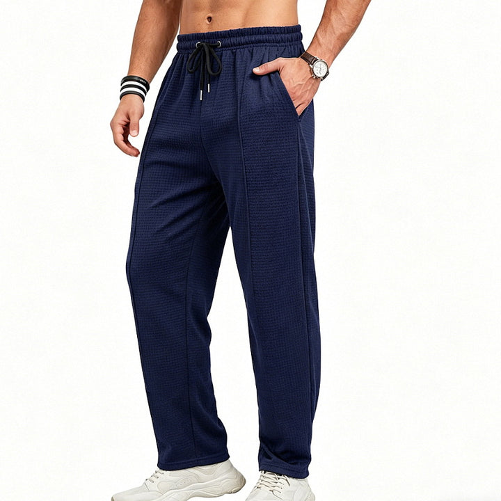 Men's straight-cut relaxed trousers with decorative center seam, elasticated drawstring waistband and side pockets StylebySassy
