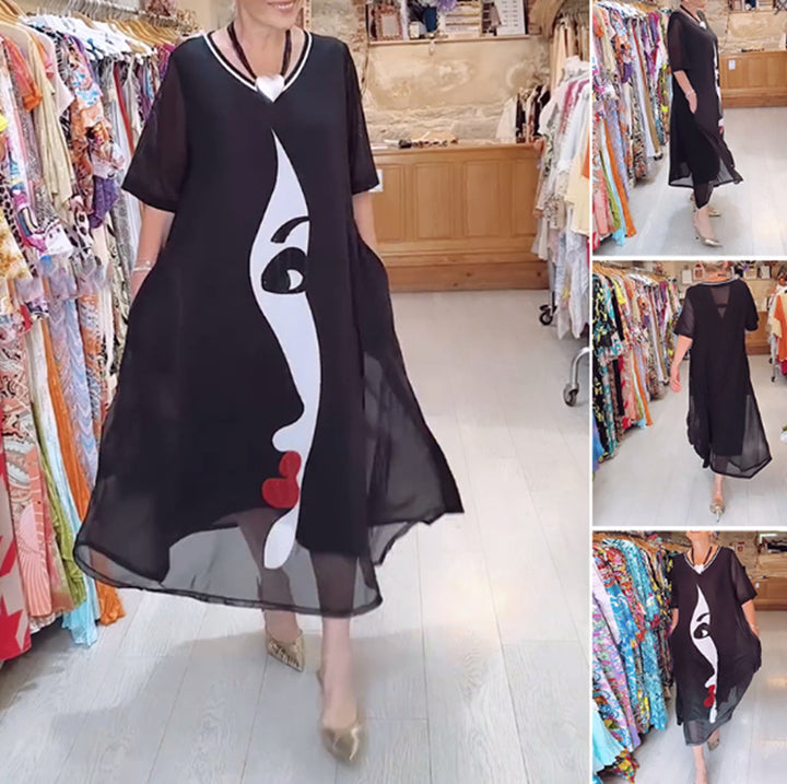 Women's airy chiffon maxi dress with graphic face print, V-neck and side pockets StylebySassy