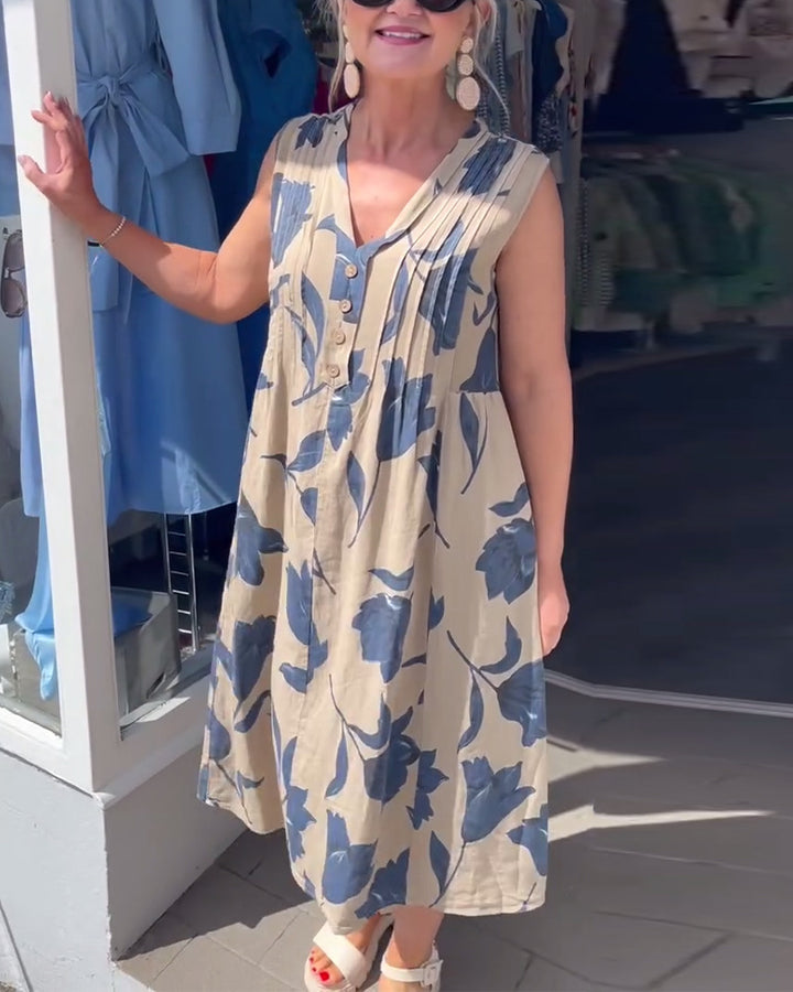 Women’s casual V-neck midi dress with bust yoke, vertical pleats, and decorative button placket StylebySassy