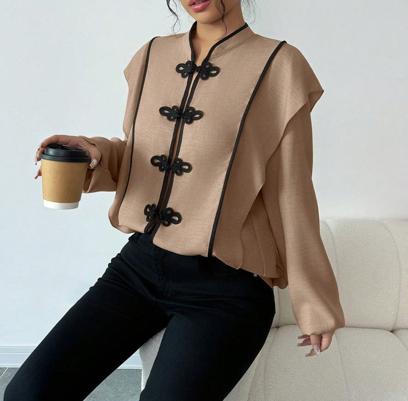 Women's stand-up collar blouse with decorative knot closures and decorative piping StylebySassy