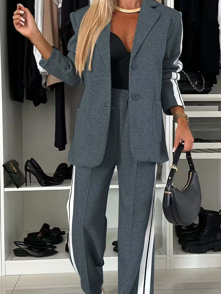 Women's elegant blazer set in sports chic with contrasting side stripes and elasticated waistband trousers StylebySassy