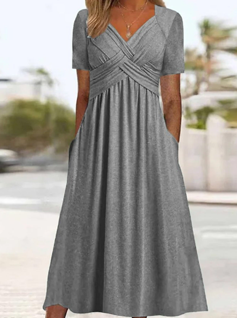 Women's flowing maxi dress with crossed yoke V-neck short sleeves and side pockets StylebySassy