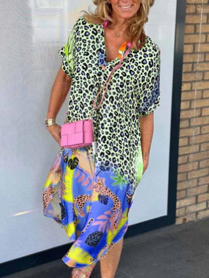 Women's loosely fitted V-neck midi dress with leopard and tropical print StylebySassy