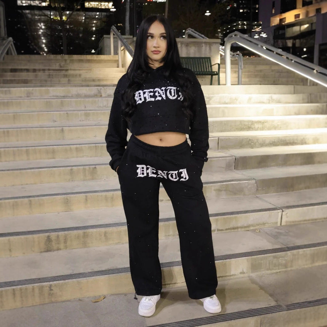 Women's wide sweatpants with all-over stars, Gothic logo print, elastic waistband, and side pockets StylebySassy