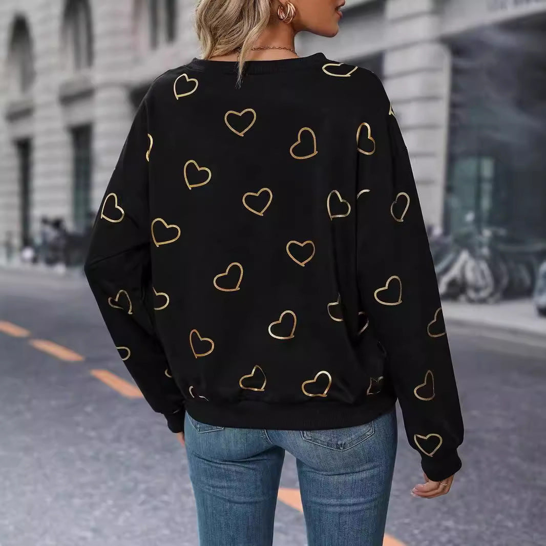 Women's loose heart print sweatshirt with round neck and ribbed cuffs StylebySassy