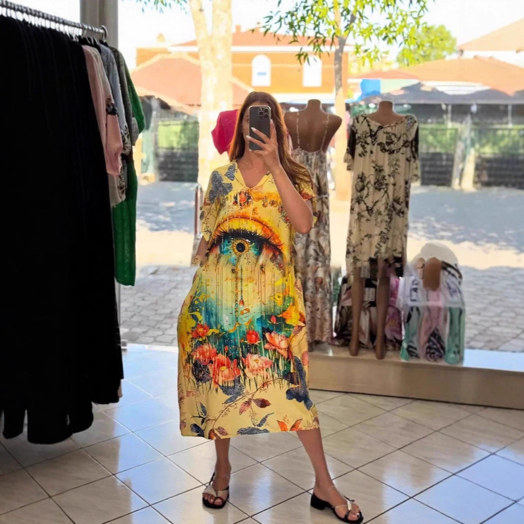 Women flowing maxi kaftan dress with V-neck and large watercolor floral print StylebySassy