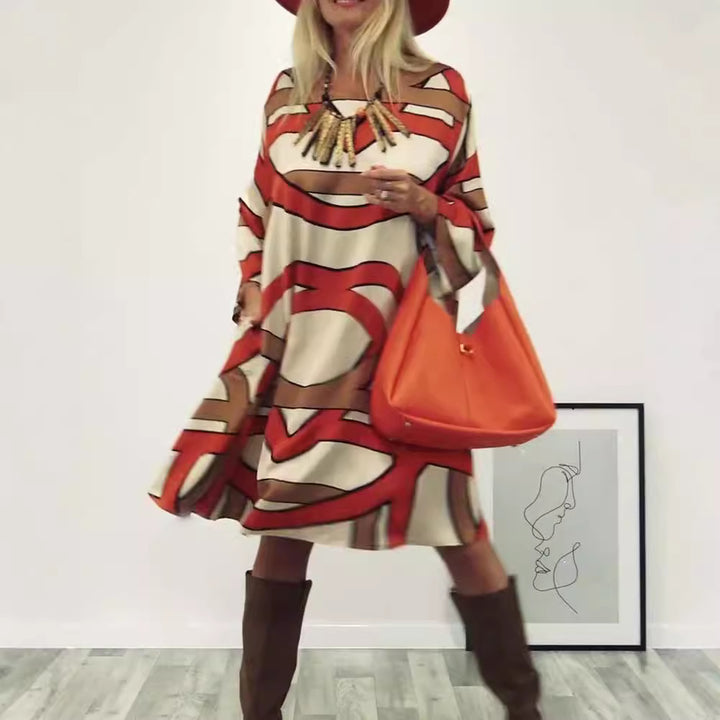 Women's generous swing dress with wide tulip hem, batwing sleeves and graphic all-over pattern StylebySassy