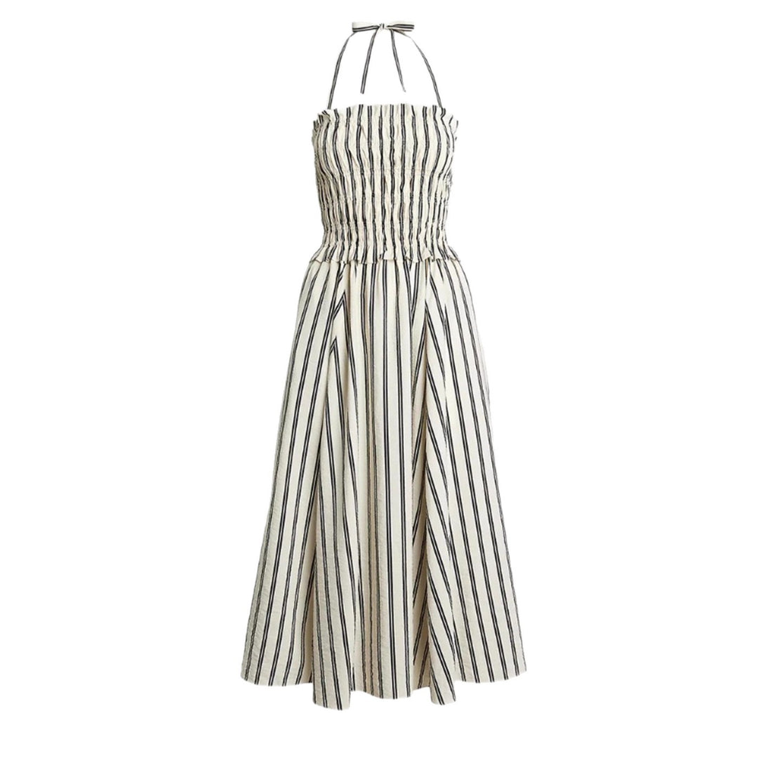 Women's midi dress with smocked bodice, adjustable halter strap, wide A-line skirt and side pockets StylebySassy