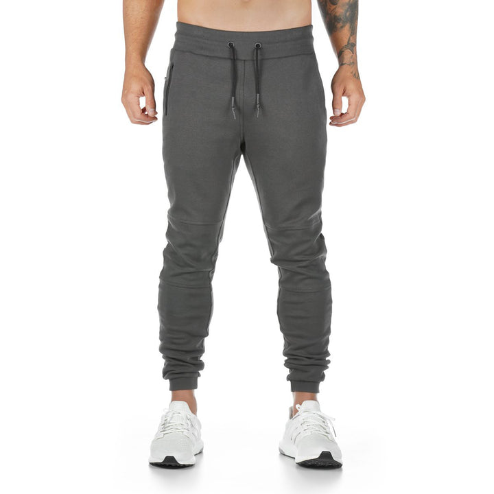 Men's narrow-cut joggers with ribbed waistband, zip pocket, and knee darts StylebySassy