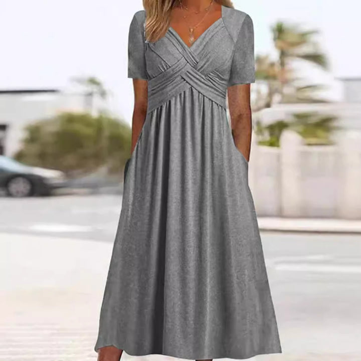 Women's airy midi dress with V-neck, wrap look, empire waist, and pockets StylebySassy