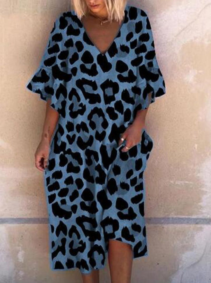 Ladies' casual midi dress in tunic style with V-neck, ruffled sleeves, and side pockets StylebySassy