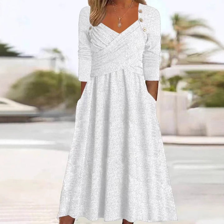 Women's knitted maxi dress with wrap top V-neck, side pockets and decorative button placket StylebySassy