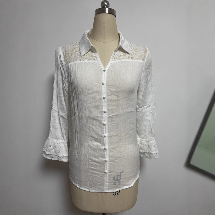 Ladies' semi-transparent crepe blouse with lace yoke, fabric-covered buttons, and three-quarter flounce sleeves StylebySassy