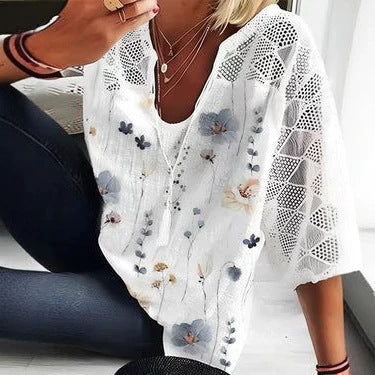 Women's V-neck tunic with lace-knit sleeves and subtle watercolor floral print StylebySassy