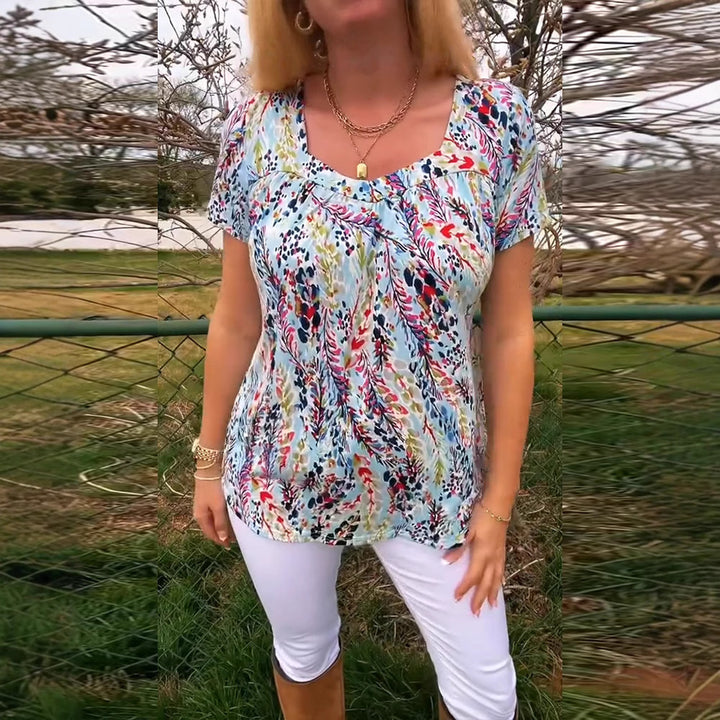 Women's light viscose blouse with boxy yoke, gathered bust section, and short butterfly sleeves StylebySassy