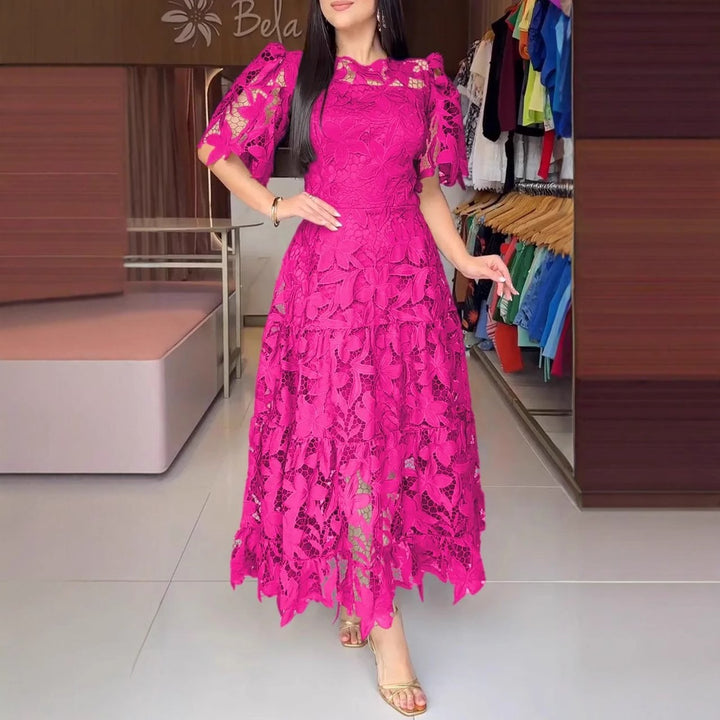 Women's maxi dress made of floral guipure lace with a fitted silhouette and tiered hem StylebySassy