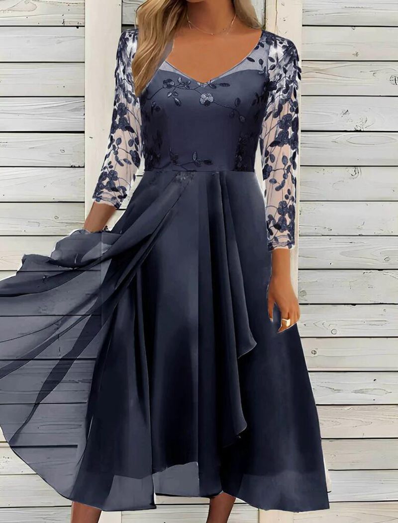 Women’s elegant midi dress with embroidered tulle top, transparent three-quarter sleeves, and layered draped skirt StylebySassy