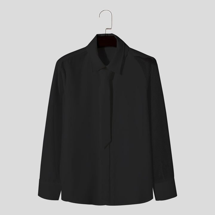 Women’s flowing blouse with attached bow, concealed button placket, and one-sided mesh sleeve detail StylebySassy