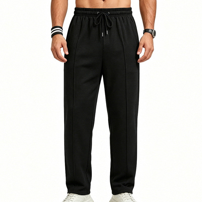 Men's straight-cut relaxed trousers with decorative center seam, elasticated drawstring waistband and side pockets StylebySassy