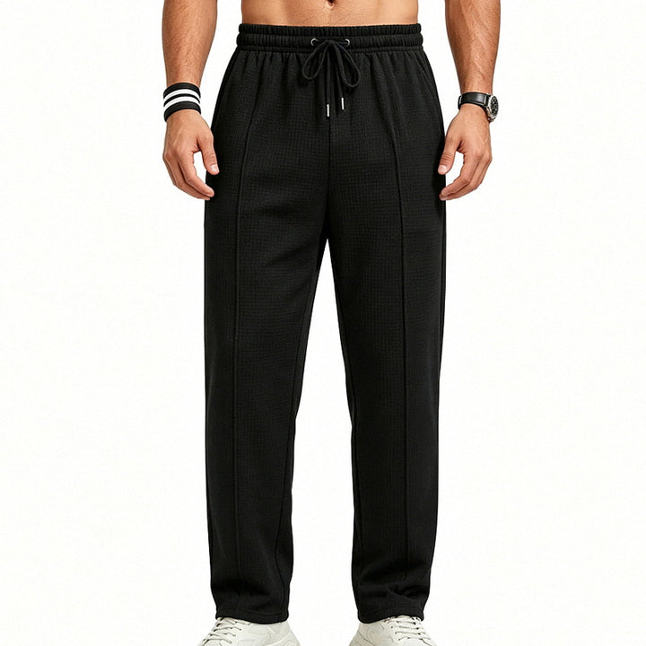 Men's straight-cut relaxed trousers with decorative center seam, elasticated drawstring waistband and side pockets StylebySassy