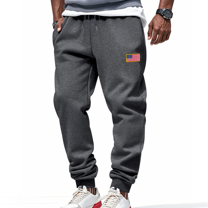 Men's slim-fit sweatpants with tapered leg, elastic drawstring waistband, and discreet flag application StylebySassy
