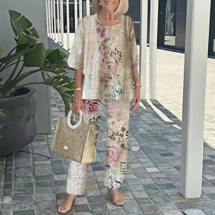 Women's layered tunic with cape sleeves and ankle-length straight leg pants with graphic print StylebySassy