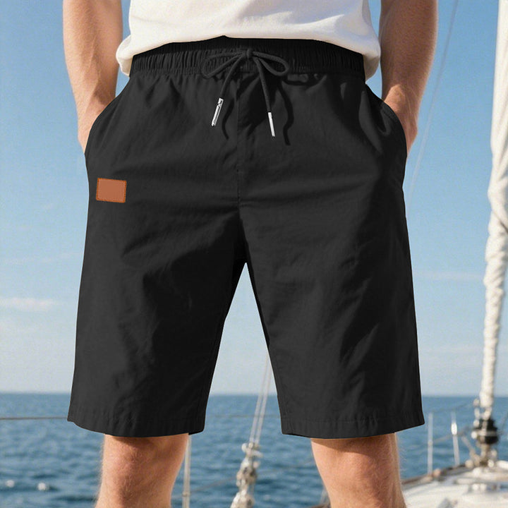 Men's quick-drying swim shorts in Bermuda cut with elastic waistband and drawstring StylebySassy