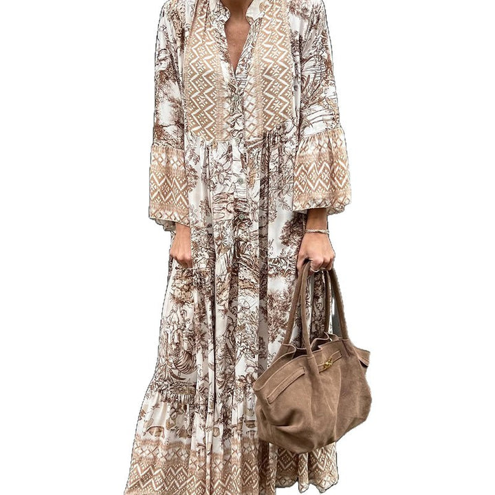 Ladies' tiered maxi dress with ethnic border, stand-up collar, and wide bell sleeves StylebySassy