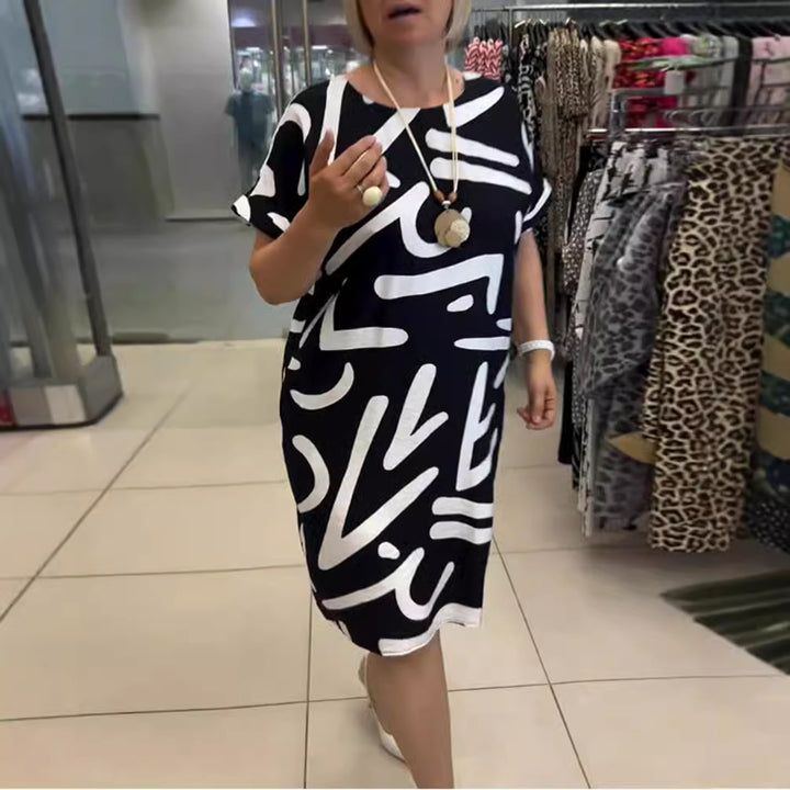 Women knee-length comfort shift dress with large brush stroke print and rolled short sleeves StylebySassy