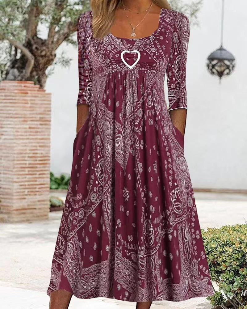 Women's maxi dress with paisley bandana pattern, empire seam, gathered underbust area, and side pockets StylebySassy