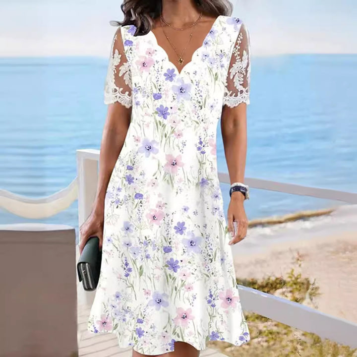 Ladies flowing midi beach dress with wavy V-neck and sheer lace sleeves StylebySassy