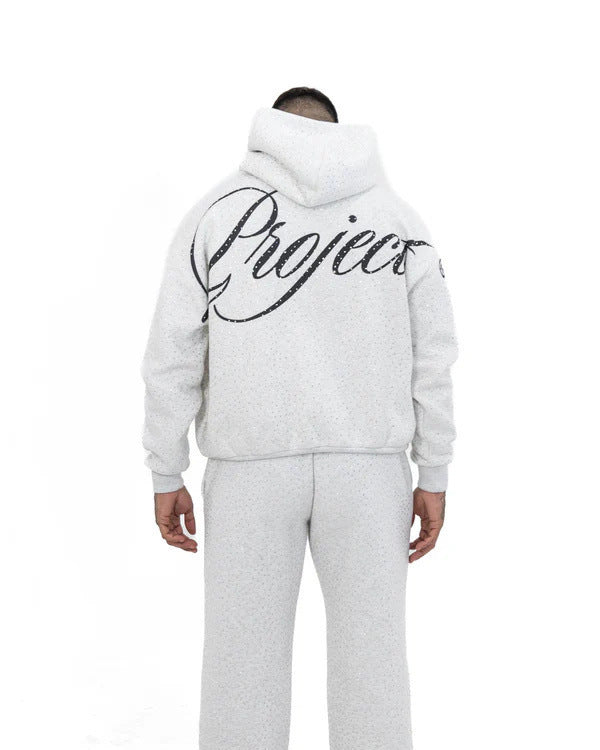 Men's wide comfort trousers with straight leg, elastic drawstring waistband, subtle logo embroidery, and fine speckled look StylebySassy