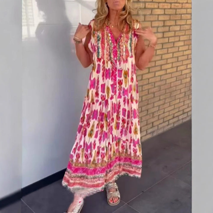 Ladies' flowing maxi dress in boho style with V-neck, tiered skirt and embroidered yoke StylebySassy