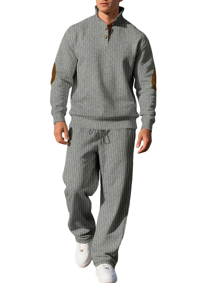 Men's fine ribbed sweater with half button placket, high stand-up collar, and contrasting suede elbow patches StylebySassy