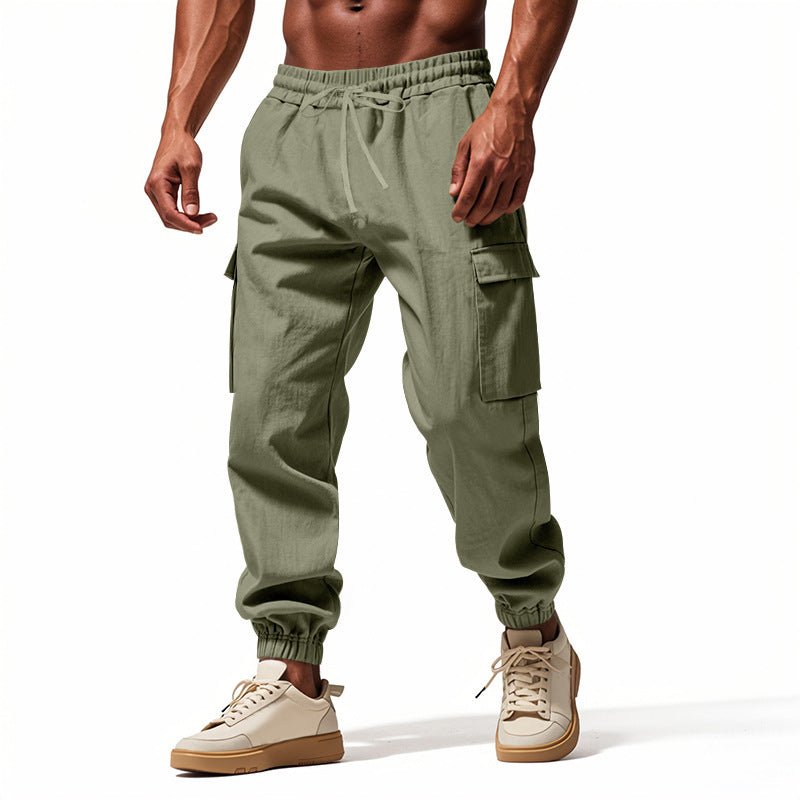 Men's tapered joggers in utilitarian style with elastic waistband, drawstring, and flap pockets StylebySassy