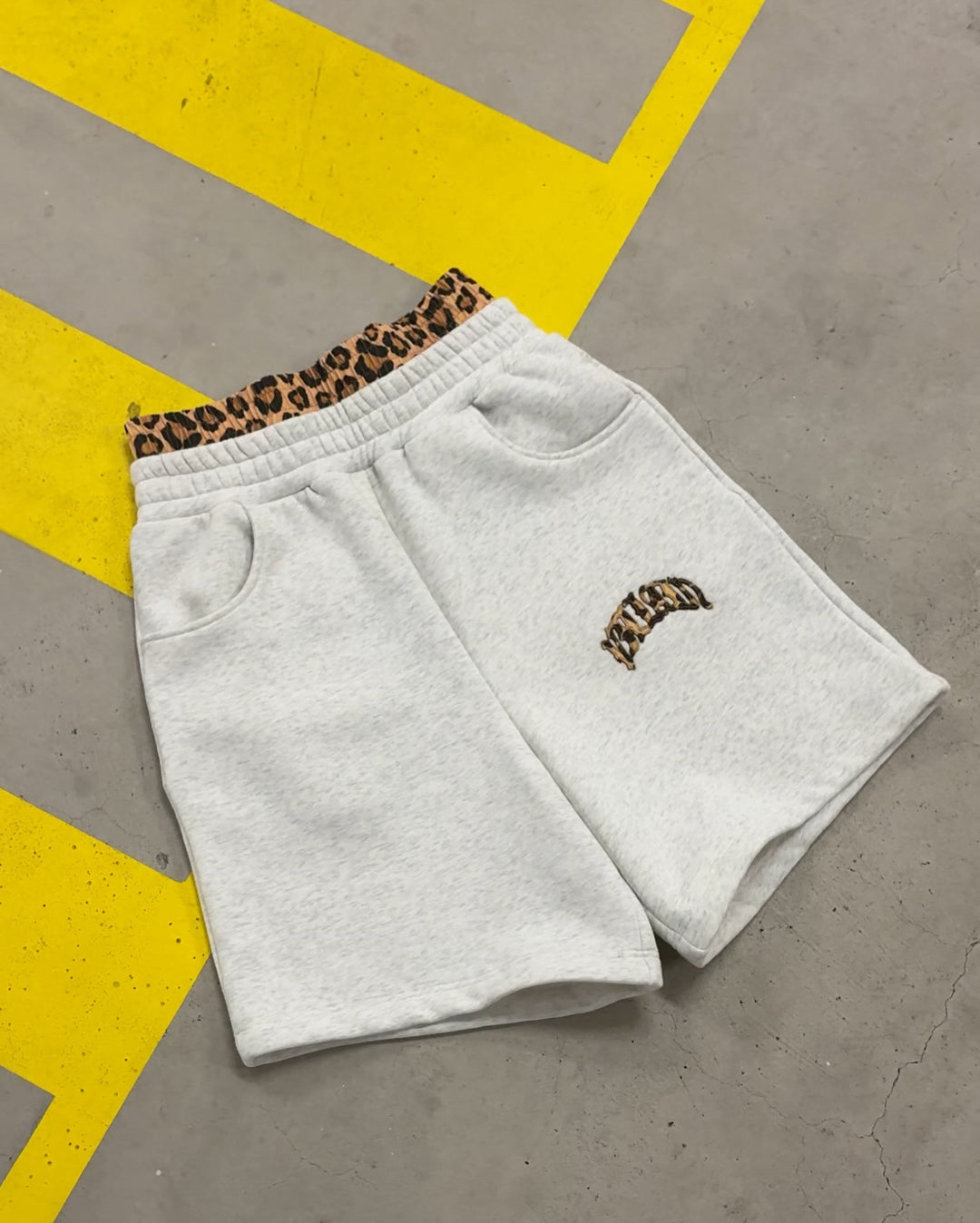 Women's high-cut jogging pants with flared leg, elastic ruffled waistband and leopard stitch detail StylebySassy