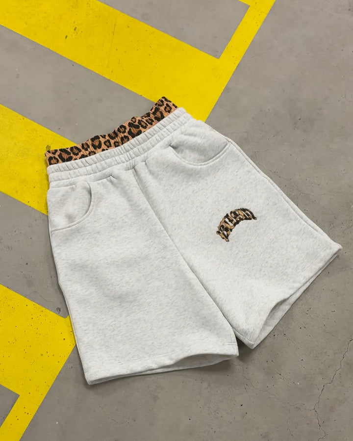 Women's high-cut jogging pants with flared leg, elastic ruffled waistband and leopard stitch detail StylebySassy