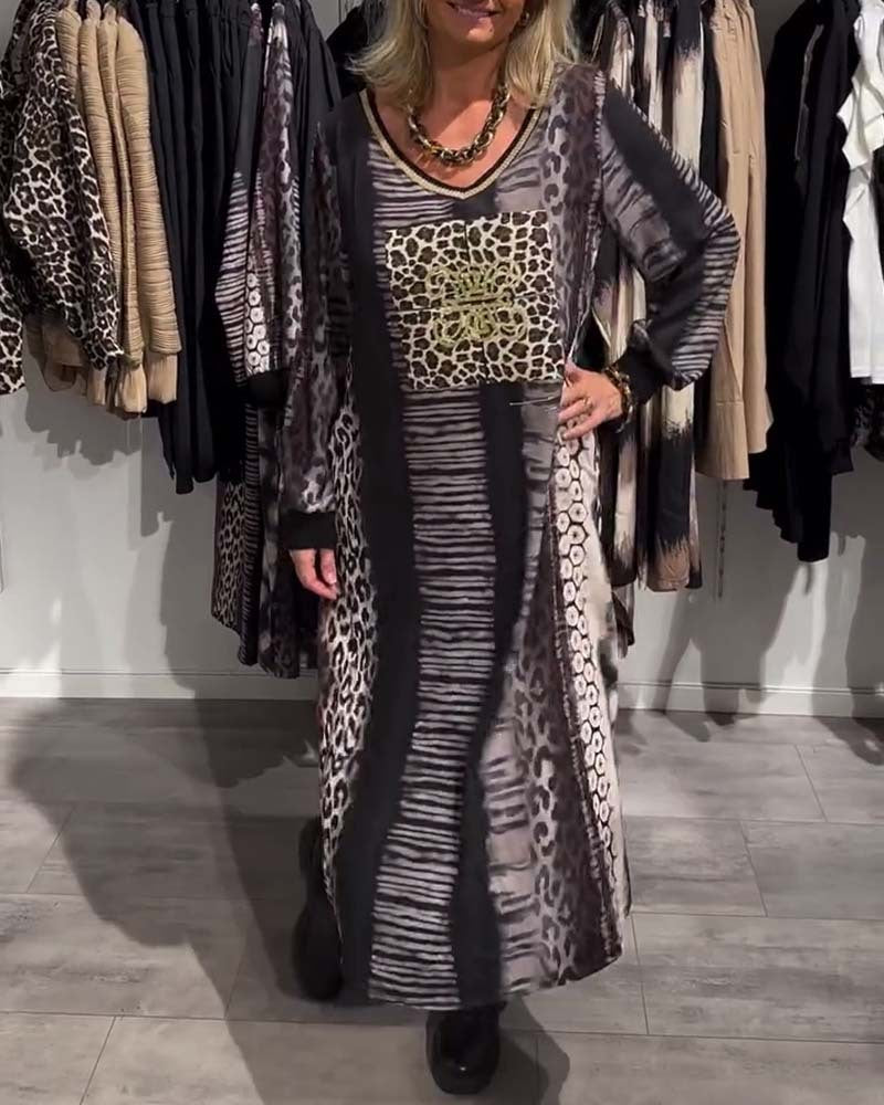 Ladies flowing panel long dress with patchwork animal print and gold-colored chest application StylebySassy