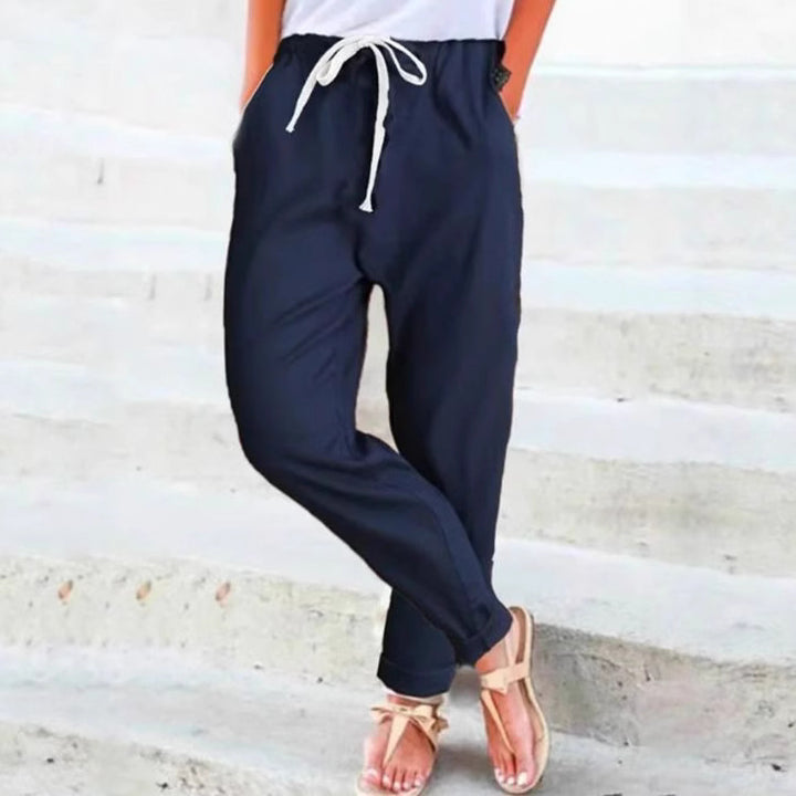 Women's light linen blend pants with elastic waistband, drawstring, and tapered ankle section StylebySassy